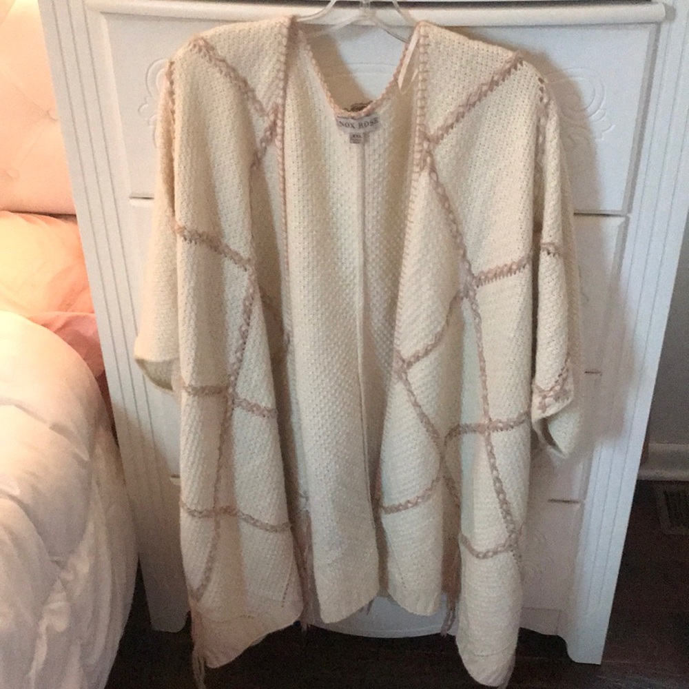 Kitted poncho like sweater